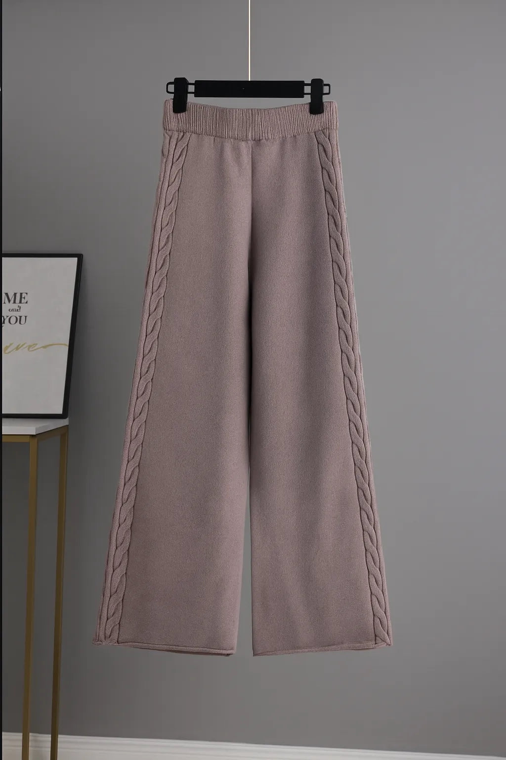 Pink knitted wide-leg pants close up