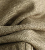 Cable-knit sweater side-slit hem detail